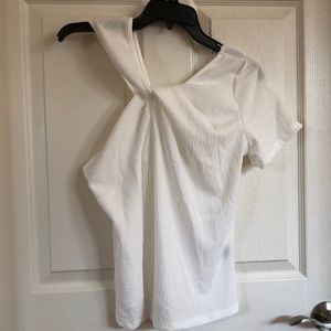 New white shirt, one shoulder t-shirt.
